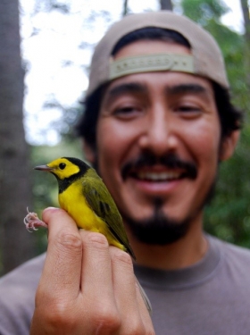 Xerónimo Castañeda - Holding a bird in the forest