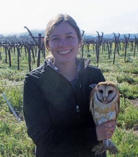 Allison Huysman - Holding an owl in a vineyard